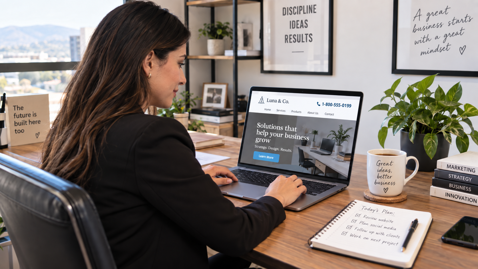 Small business owner reviewing their company website with a 1-800 number displayed